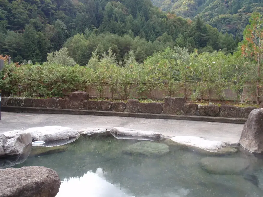 Stone-edged outdoor bath at Kojin no Yu in Tochio Onsen